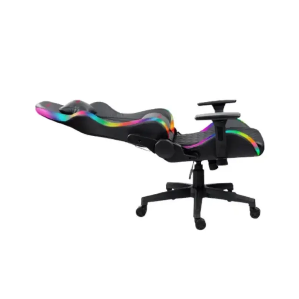 Gamer seated in the Xtrike Me GC-907 RGB chair at a desk setup